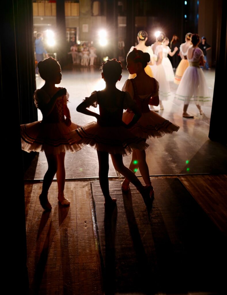 children ballerinas backstage at a show